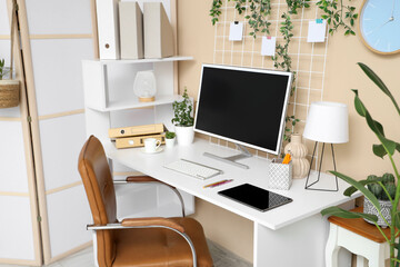 Interior of office with workplace, tablet and computer