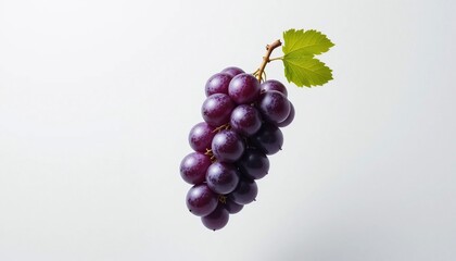 Fototapeta premium Fresh Red Grapes Bunch with Green Leaves Isolated on White Background Healthy Food Fruit