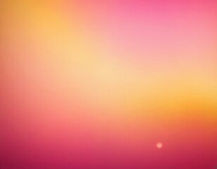 Obraz premium A serene gradient of pink and yellow hues at sunset, creating a tranquil atmosphere.