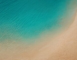 A serene beach scene featuring clear turquoise waters meeting a soft sandy shore.