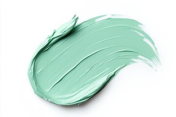 Isolated swatch of green concealer on white background creamy makeup texture