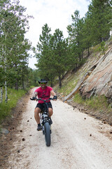 Naklejka premium Man with e-bike on the George S. Mickelson Trail, South Dakota