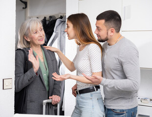 Elderly mother visits her adult children at their home