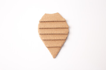 a piece of cardboard cut into a shape resembling an insect body craft. horizontal lines running across it, creative use of cardboard, suitable for arts and crafts projects for educational purposes