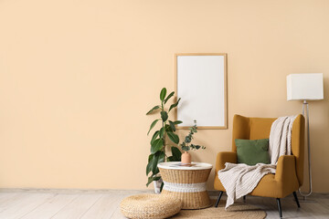 Armchair, coffee table with eucalyptus in vase and ficus houseplant near beige wall in room