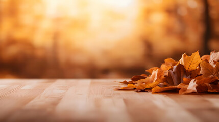 Obraz premium A close-up of colorful autumn leaves on a wooden surface, showcasing nature's beauty in a serene, warm setting.