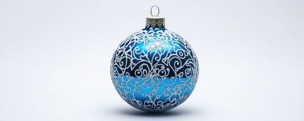 Blue christmas ornament with intricate silver swirl design