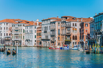 The Grand Canal, with gondolas, boats, ancient buildings and palaces. It is the main navigation channel linking Basin São Marcos to the Santa Lucia railway station. Venice, Italy, 2019