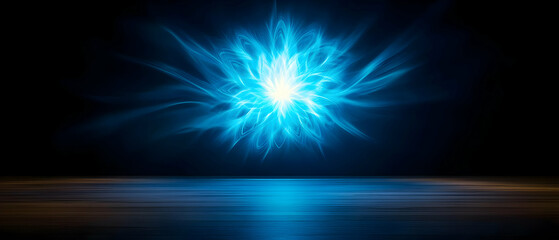 Obraz premium A stunning blue abstract light burst creates a mesmerizing visual effect against a dark background.