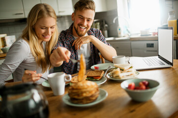 Young couple having breakfast in the morning