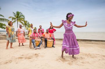 Beautiful Garifuna girl dances on the tips of her toes.