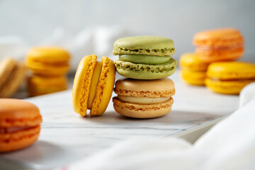 Colorful yellow, green Macrons closeup. Sweet dessert, sugar