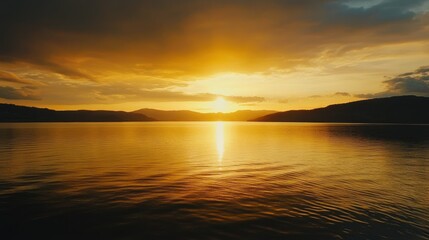 Fototapeta premium A serene view of a bright sunset reflected in the peaceful waters of the sea