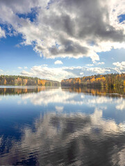 Fototapeta premium Lake with a cloudy sky in the background