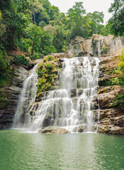 Obraz premium waterfall in costa rica, deep in the jungle 