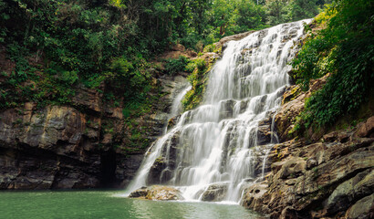 Obraz premium waterfall in costa rica, deep in the jungle 