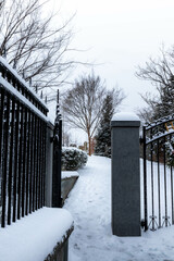Snow Covered Entryway to a Graveyard