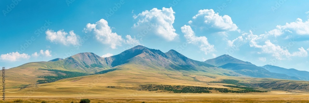 Aufkleber Majestic mountain range rises under soft clouds and a clear blue sky inviting exploration and adventure in natures beauty. Generative AI