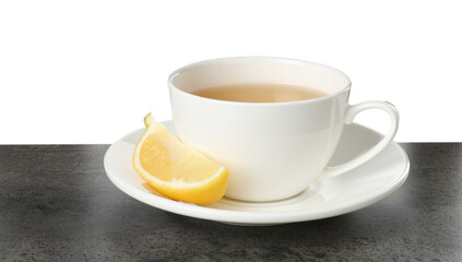 Refreshing green tea in cup and slice of lemon on grey textured table against white background