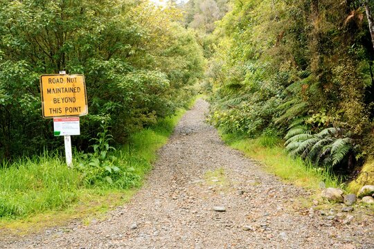 Road Not Maintained Beyond This Point Sign on a Miserable Gravel Road