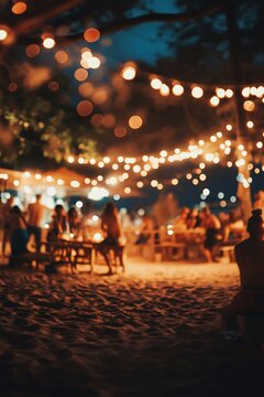 Tourists are having a good time at night on the beach