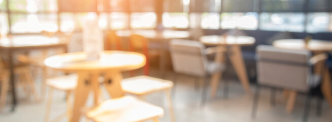 Banner Blurred background cafe coffee shop restaurant in shopping mall with light bokeh business event retail store. Banner blurry background interior design bar table chair windows with copy space
