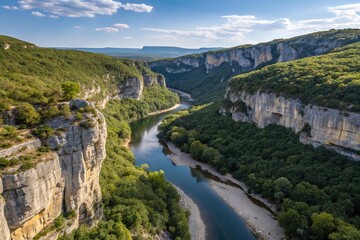 Obraz premium Drone view of the serene Ardèche Gorges, France, showcasing a winding river and rugged canyon walls in a peaceful, untouched landscape.