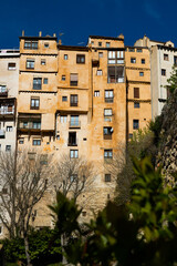 Curious architecture of ancient skyscrapers built on hill above gorge in Spanish city of Cuenca in spring..