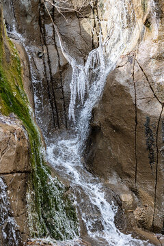 Ice cycle cover small waterfall inside the zoo