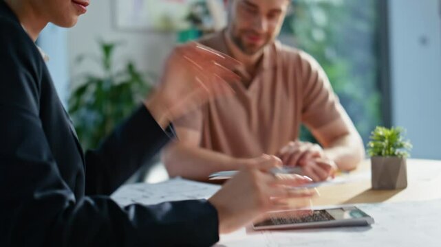 Woman stock trader calculating project at meeting with smiling client closeup.