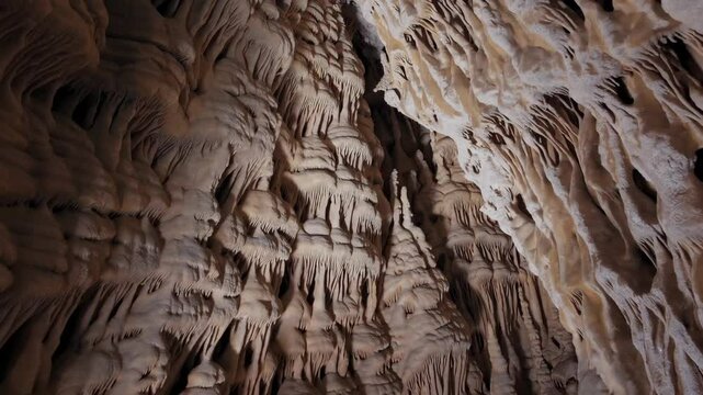 Stalactites and stalagmites in a limestone cave, geological wonder. Natural rock formations and underground exploration concept