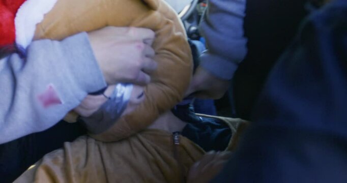 Guy in funny bear suit being kidnapped and having his mouth covered in duct tape - steady cam shot