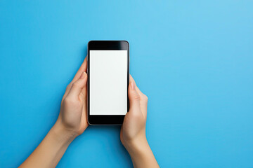 Two Hands Holding a Smartphone with Blank White Screen on Blue Background