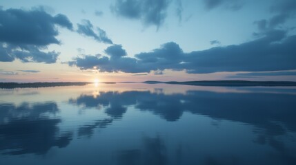Obraz premium Serene Sunset Over Calm Waters with Reflections of Clouds in Tranquil Landscape