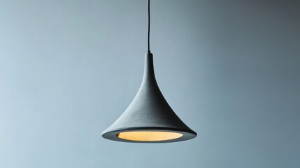 Fototapeta premium Modern concrete pendant lamp, minimalist interior, soft light, blue wall