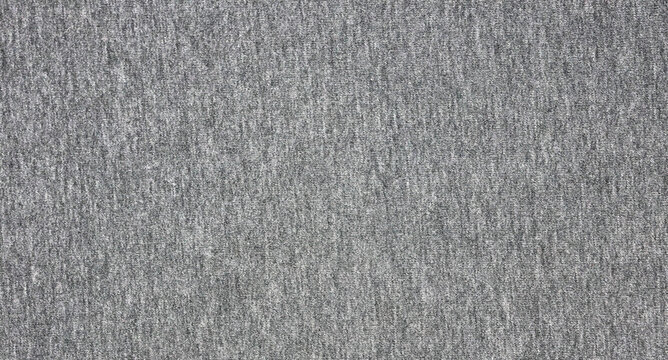 Close up abstract gray cotton heather texture background. Black and white texture knit fabric pattern seamless. Selective focus. top view.
