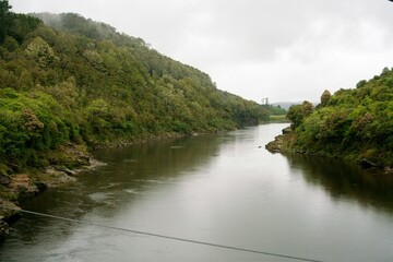 The Grey River on a Cloudy Day – Calm Water Landscape