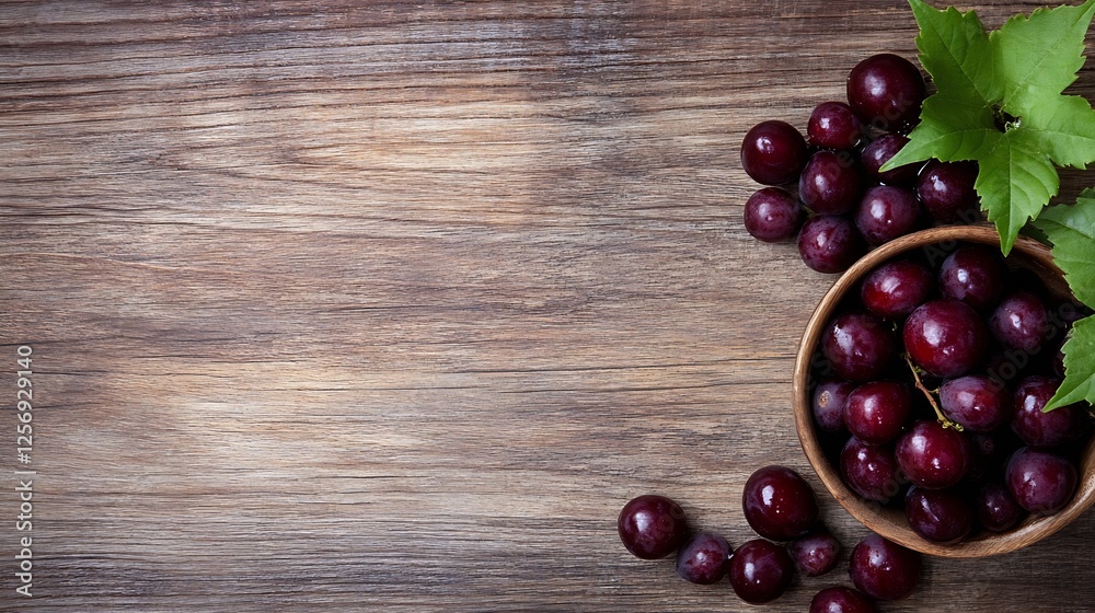 Poster fresh grapes in a wooden bowl surrounded by green leaves on a rustic table : generative ai
