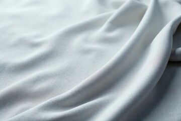 Obraz premium Elegant Draped Light Gray Fabric Texture Background, Ideal for Fashion and Design Projects