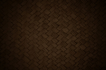 Dark brown bamboo weaving pattern, old woven rattan mat texture for background and design art work.