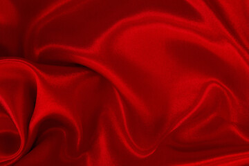 Red fabric cloth texture for background and design art work, beautiful crumpled pattern of silk or linen.
