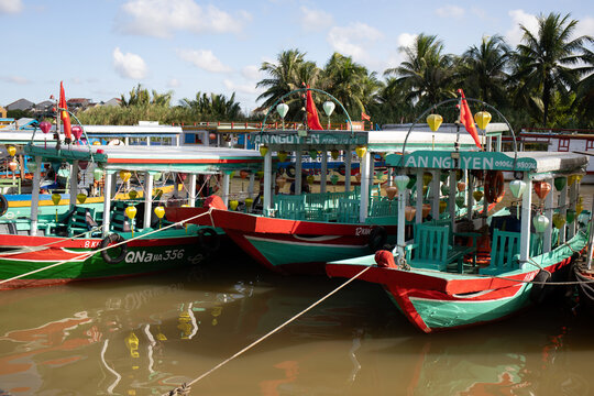 Lantern boat docked during the day on Thu Bon River in Hoi An, Vietnam