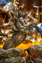 Close-up of a bronze sculpture of a prancing horse