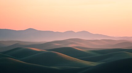 Fototapeta premium Serene Sunset Over Rolling Hills And Distant Mountains