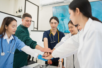 Male and female doctors are having a meeting in a hospital room.