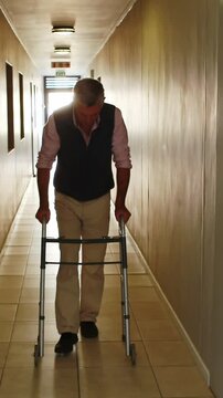 Patient walking with zimmer frame