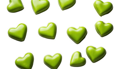 Green heart-shaped candies falling on transparent background