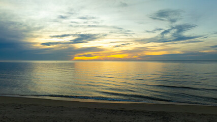 Fototapeta premium Nature sunset sky, the sun rises on the horizon, colorful sky at sea , nature concept background.
