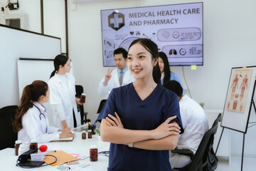 A diverse team of doctors and nurses work together in a hospital office and talk to each other. Teamwork and dedication to providing quality healthcare and medical solutions.
