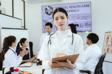 Fototapeta premium A diverse team of doctors and nurses work together in a hospital office and talk to each other. Teamwork and dedication to providing quality healthcare and medical solutions.